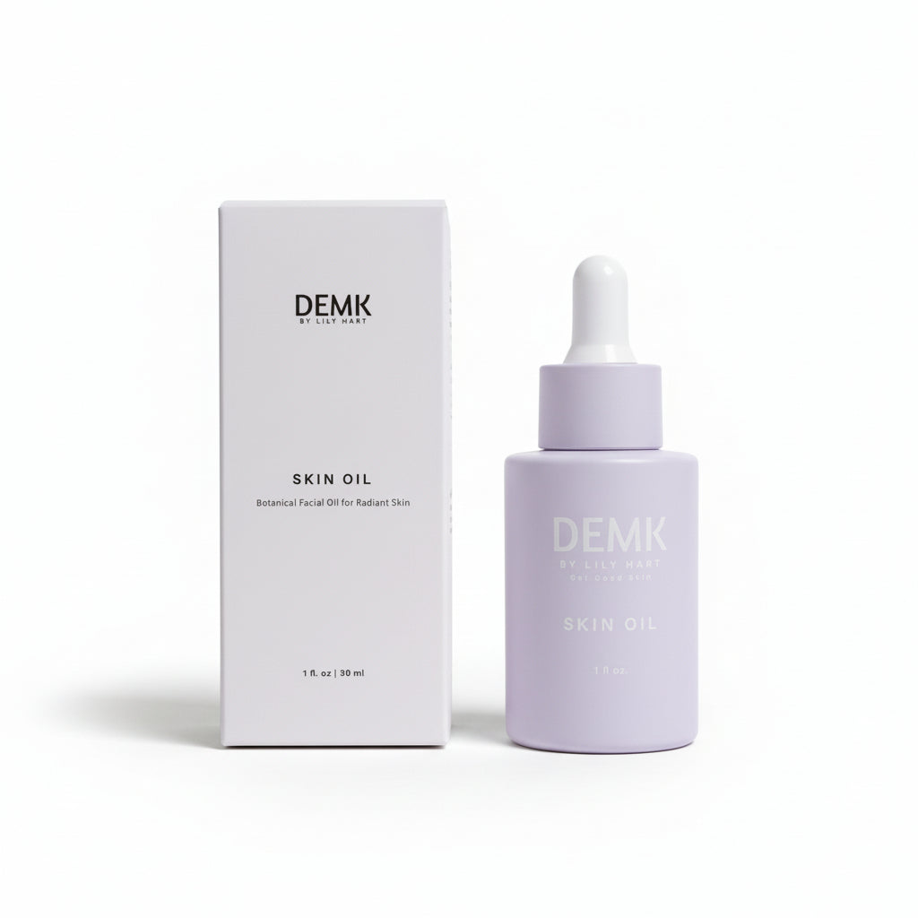 DEMK Skin Oil dropper bottle and box with ingredients — castor, jojoba, black seed, rosehip oils, frankincense, colloidal silver